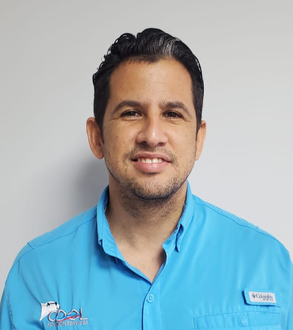 a man in light blue dress with cool solution service logo on it is smiling